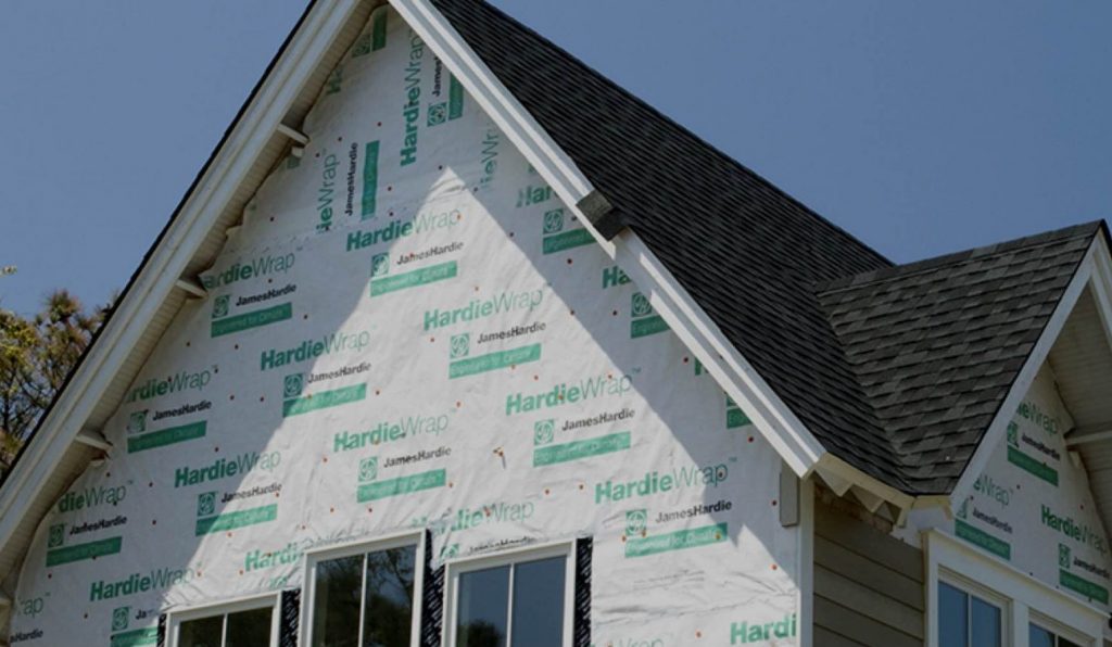 Stock photo of house wrapped in HardieWrap while undergoing a remodeling project